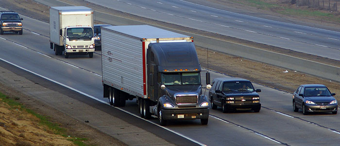 semi truck driving on interstate